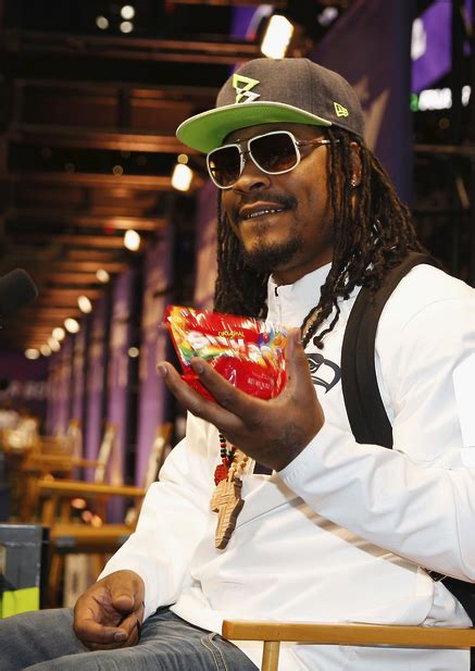 Here, he lifts a barbell 4of10marshawn lynch lifts a barbell filled with skittles above his head during a commercial shoot. Marshawn Lynch's face is now on a pack of Skittles, where ...