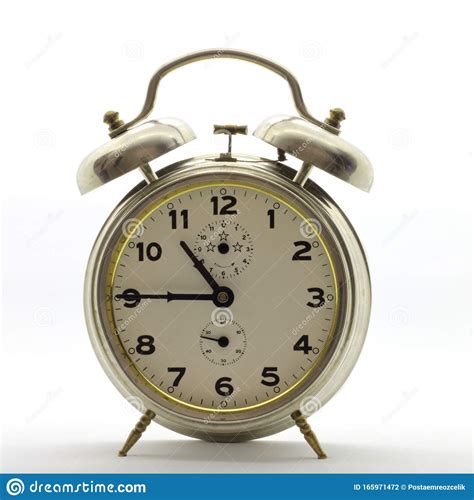 Old Style Alarm Clock Metal It`s Quarter To Eleven Stock Photo
