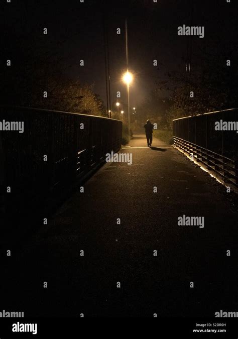 Man Walking At Night