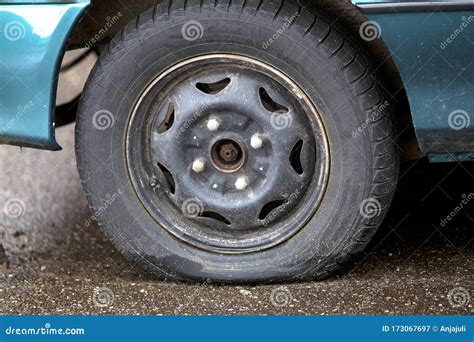 Old Tire Damaged And Worn Black Tire Tread Change Time Stock Photo