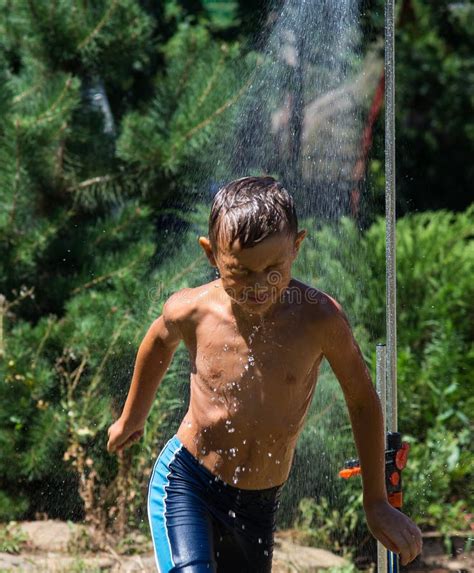 Boy Under A Shower Stock Image Image Of Grass Growth 71188975