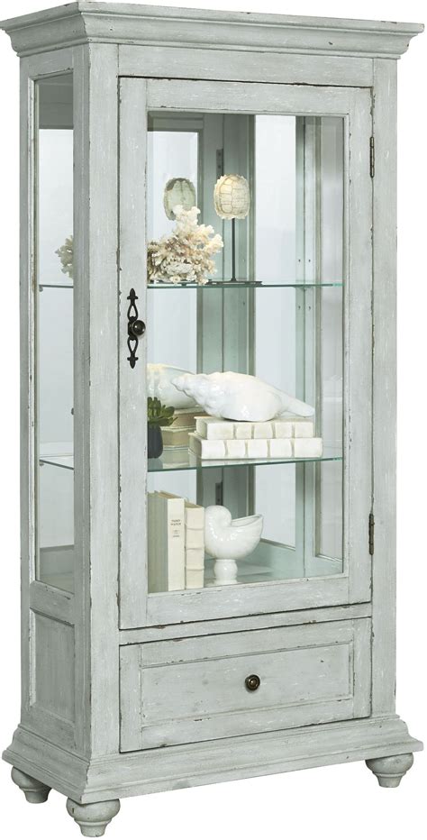 The best way to use a curio cabinet. Zadie White Accent Curio from Pulaski | Coleman Furniture