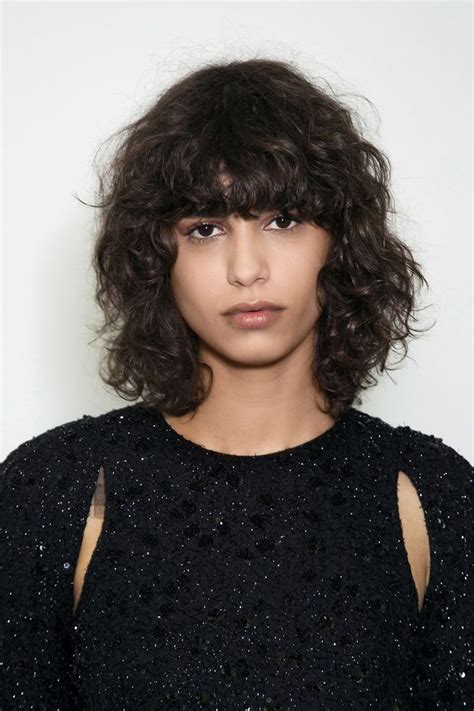 must read curly bangs are a stunning trend if you refuse to “tame the mane” curly bangstyle
