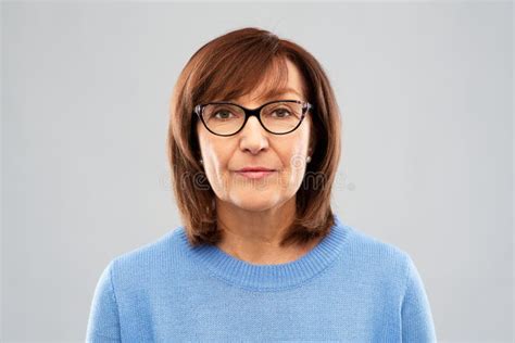 Portrait Of Senior Woman In Glasses Over Grey Stock Image Image Of