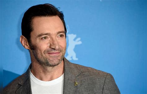 Smiling Hugh Jackman Lands In Rio After Sixth Cancer Treatment