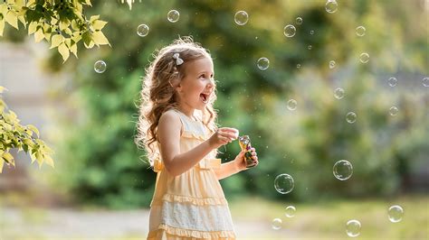 Smiling Little Girl Child Is Playing With Bubbles Hd Cute