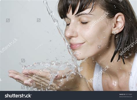 Happy Beautiful Woman Wash Her Face With Pure Water Stock Photo