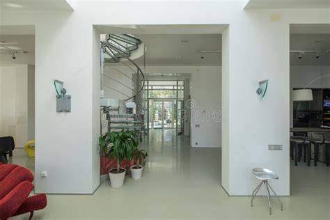 Spiral Staircase Made Of Metal And Glass In Luxury Private House Stock