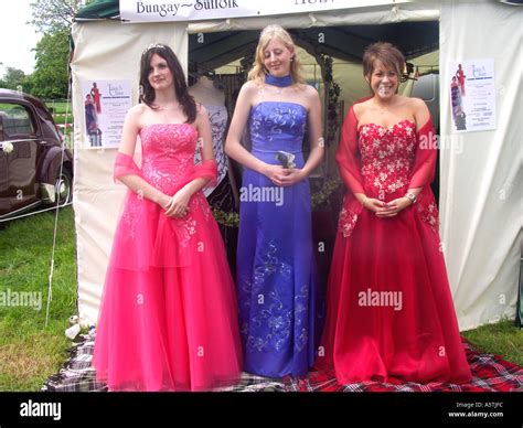 Three Women Wearing Evening Dresses To Advertise Clothes Hire Company