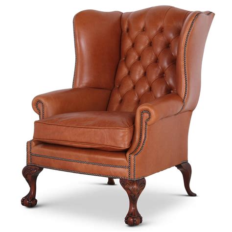 Leather is a traditional option for wing back chairs due to its durability. Coleridge traditional buttoned wing chair in Tan leather ...
