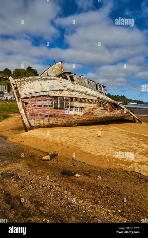West Coast Sandy Beach With Falling Apart Shipwreck Stock Photo Alamy