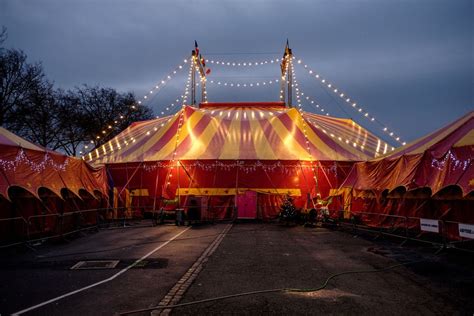 The Circus Tent Is Lit Up At Night