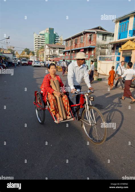 Rickshaw Carrying Woman In The Street In Yangon Rangoon Myanmar