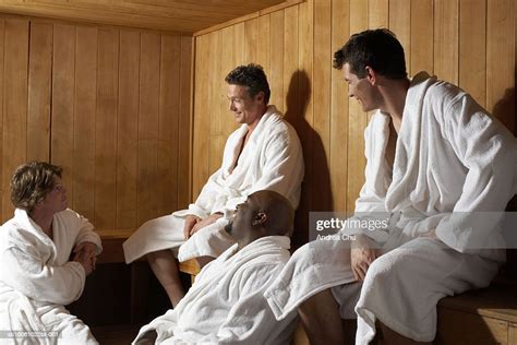 Three Men And Woman Talking In Sauna Photo Getty Images