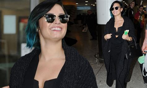 Demi Lovato Flashes A Hint Of Cleavage In Sexy Bra Top As She Jets In