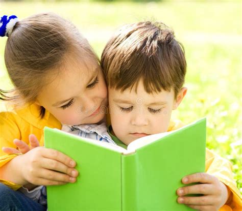 Little Boy And Girl Is Reading Book Stock Photo Image Of Caucasian