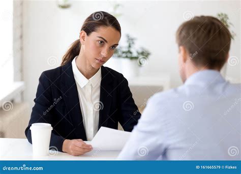 Young Female Hr Manager Conducting Job Interview With Male Applicant