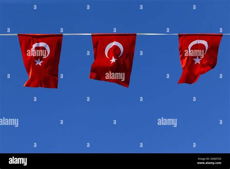 Many Red Turkish Flags Isolated At Sunny Blue Sky Background