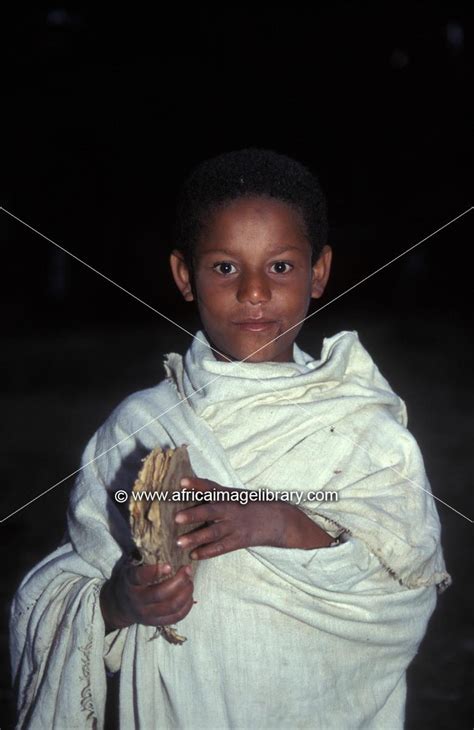 Photos And Pictures Of Boy With A Bible At An Early Morning Mass