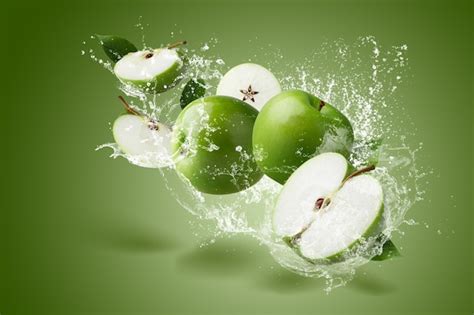 Premium Photo Water Splashing On Green Apple With Green Leaf And Cut