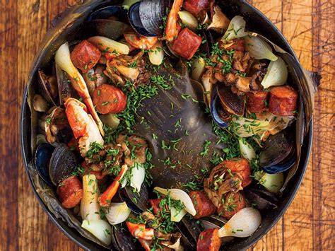 .clambake includes littleneck clams, baked chicken, choice of potatoes, corn on the cob, choice of salad, rolls and butter, clam broth, and place you can even rent clam steamers. Ultimate Oven Clambake Recipe | Food & Wine