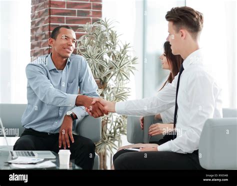 Handshake Manager And Customer In A Modern Office Stock Photo Alamy