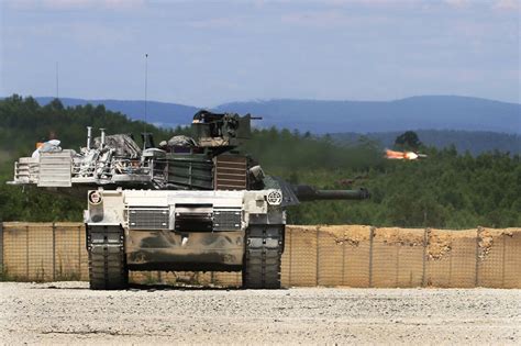 A Us Army M1a1 Abrams Tank Engages Targets As A Tube Launched