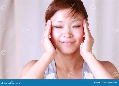 Young Japanese Woman Doing A Self Face Massageã€€ Stock Image Image Of Pleasant Lying 43867853