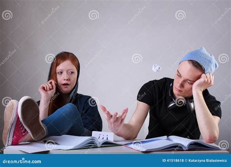 Bored Teenage Girl Sitting In Classroom Royalty Free Stock Photography