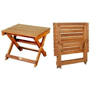 Two Wooden Folding Chairs And A Small Table