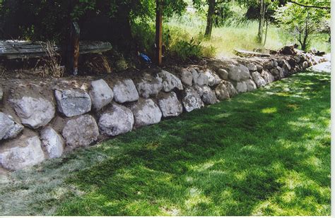 Landscaping that accents the house and frames a front deck also reduces mowing on this steep yard. Retaining Walls in Salt Lake | Ridgeline Landscaping Salt ...