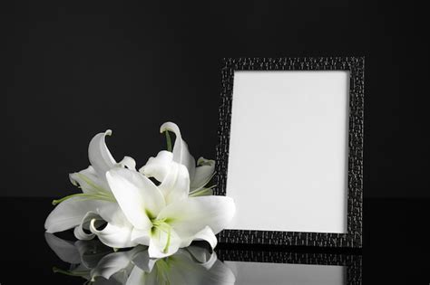 Premium Photo Funeral Photo Frame And White Lilies On Black Table