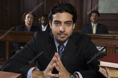 Male Advocate Sitting In Courtroom — Stock Photo © Londondeposit 21861671