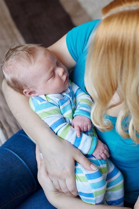 Loving Mother Hand Holding Cute Sleeping Newborn Baby Child Stock Image