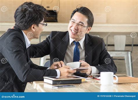 Friendly Middle Aged Boss Manager Talking With Staff Employee