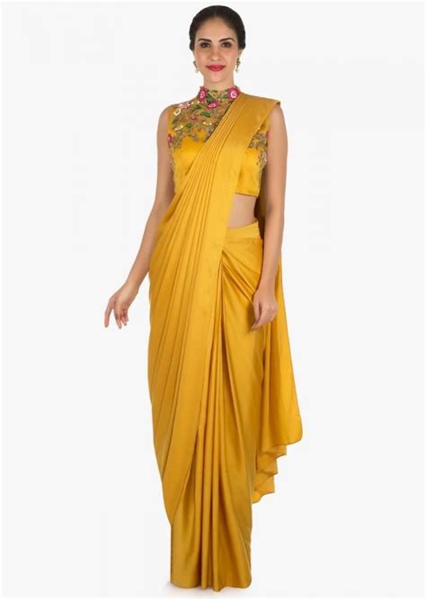Mustard Ready Pleated Saree With A High Neck Blouse Embellished In Resham And Moti Work Only On