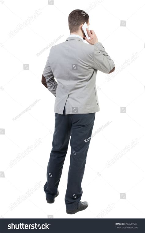Back View Of Business Man In Suit Talking On Mobile Phone Rear View