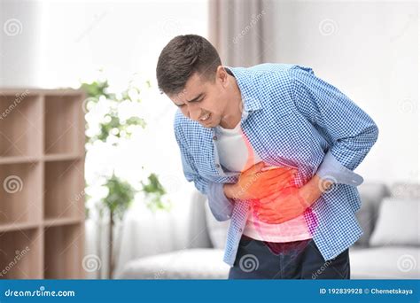 Young Man Suffering From Stomach Ache Stock Photo Image Of Caucasian