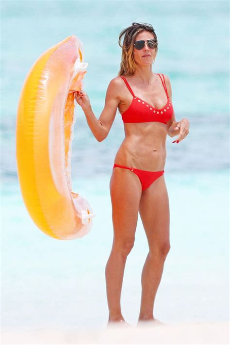 Heidi Klum Looks Red Hot As She Puts On Busty Display In Tiny Bikini