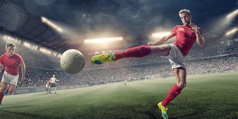Soccer Player In Mid Air Volley Action During Football Match Stockfoto En Meer Beelden Van