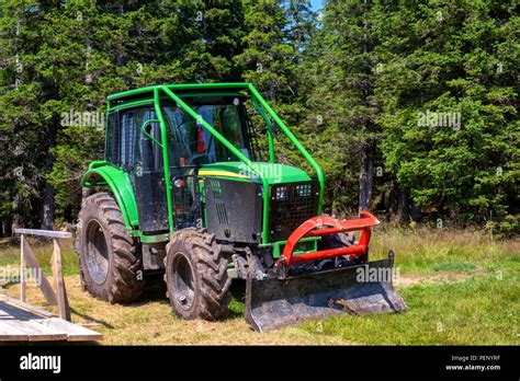 Green Forestry Tractor With Roll Cage And Plough Timber Industry