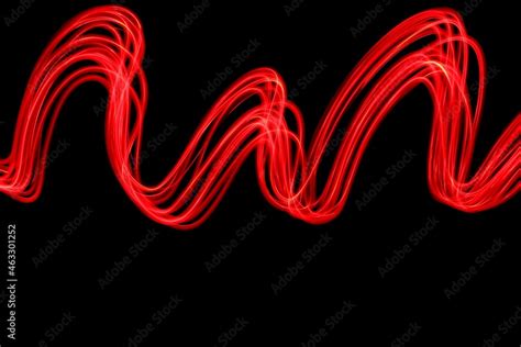 Long Exposure Photograph Of Neon Red Colour In An Abstract Swirl