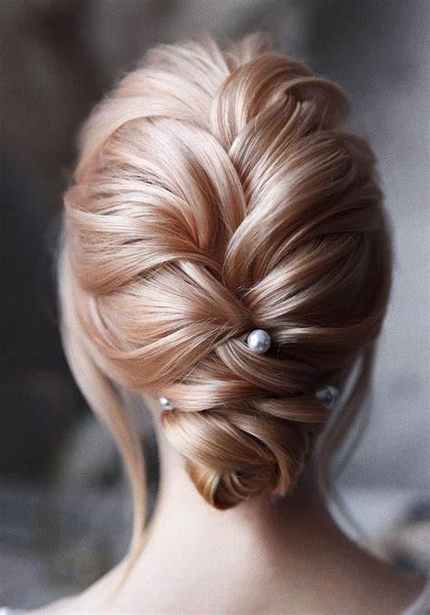 20 Trendy Low Bun Wedding Updos And Hairstyles 2024