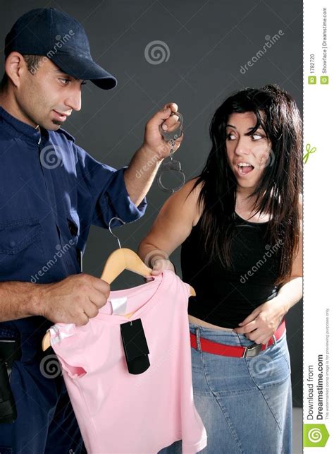 Shoplifting Is A Crime A Security Guard Dangles Handcuffs At A Shoplifter Reta Sponsored