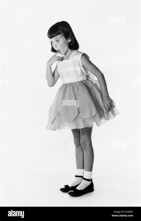 Little Girl In Dress With Surprised Expression Stock Photo Alamy