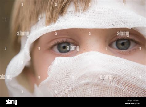 Young Boy With Bandage Wrapped Around His Head Stock Photo Alamy