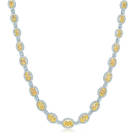 Oval Fancy Intense Yellow Diamond Necklace In Platinum With White