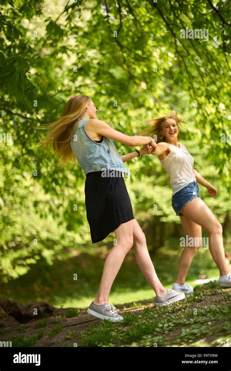 Two Best Friends Dancing Together In Nature Stock Photo Alamy
