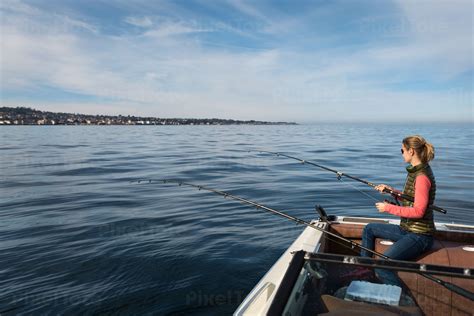 Young Woman Ocean Fishing From Stock Photo Pixeltote