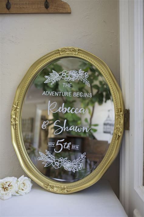 Gold Oval Mirror Hand Painted As A Welcome Sign With Floral Detail And